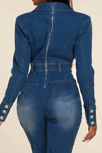 Detail view of denim jumpsuit back with metal zipper and stone-washed vintage texture
