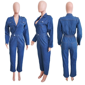 Detail of dark blue denim jumpsuit featuring V-neckline, cargo pockets and elastic waist