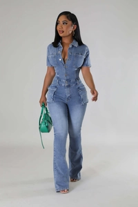Detail view of denim jumpsuit with cargo pockets and washed light blue flared trousers