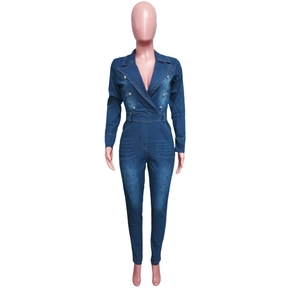 Close-up of dark blue denim jumpsuit featuring a tailored lapel and double-breasted buttons
