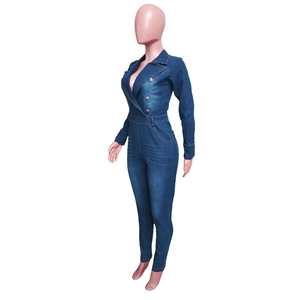 Detail of slim-fit dark blue denim jumpsuit with lapel collar and double-breasted buttons