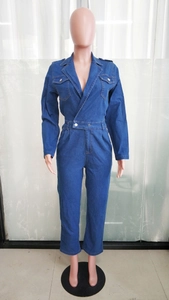 Detail of a dark blue denim jumpsuit featuring long sleeves and lapel collar design