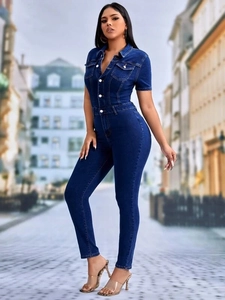 Slim fit dark blue denim jumpsuit with short sleeves and chest pockets on city street