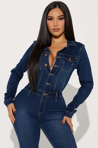 Detailed close-up of dark wash slim fit denim jumpsuit with button closure and long sleeves