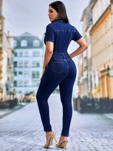 Slim fit dark blue denim jumpsuit featuring short sleeves and a stylish back view