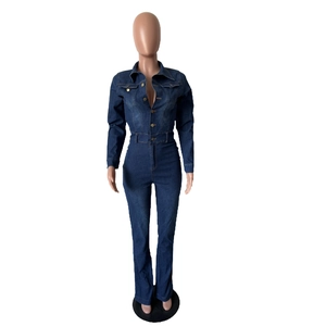 Detail of slim-fit denim jumpsuit with long sleeves and vintage gold buttons