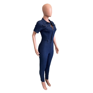 Detailed side view of slim fit dark blue denim jumpsuit with short sleeves and collar