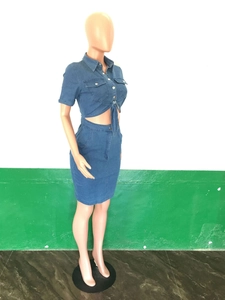Detail showing two-piece denim set with short sleeve tie-front top and bodycon skirt