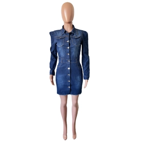 Detail of puffed sleeves and metal buttons on a slim-fit dark blue denim jacket dress