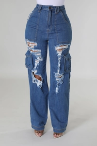 Detailed view of dark blue high-waist wide-leg denim jeans with ripped holes and cargo pockets