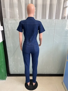 Slim fit dark blue denim jumpsuit featuring a classic collar and back pocket detailing