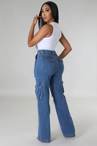 Close-up of high-waisted cargo jeans with side flap pockets and distressed hem detail
