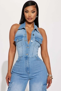 Detail of light blue denim jumpsuit featuring a halter neck and cargo flap pockets