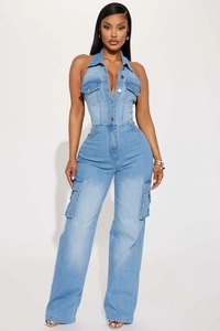 Detail of light blue washed denim jumpsuit with a lapel collar and halter back