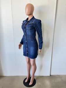 Detailed close-up of dark blue denim mini dress showing sleeve cuffs and frayed hem
