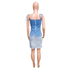 Back view of gradient denim dress featuring a long silver zipper and raw hem detail