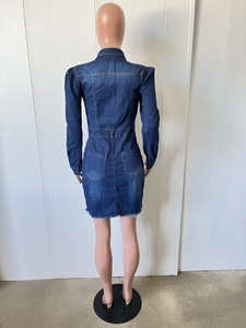 Detail view of denim dress back with symmetrical pockets and frayed raw hemline