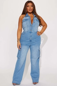 Detail view of light blue denim jumpsuit with cargo pockets and halter neck design
