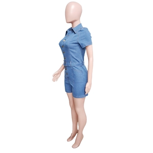 Detailed side view of light blue denim short sleeve romper with waist belt design