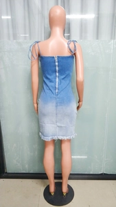 Detail of adjustable string straps and back zipper on this slim denim dress