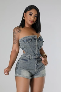 Detail of slim fit strapless denim romper with front buttons and chest pockets