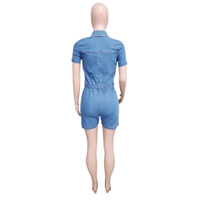 Back view of slim fit denim romper with short sleeves and waist loops in blue