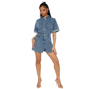 Front view detail of short sleeve denim romper with utility pockets and button closure