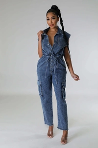 Detail view of denim jumpsuit with turn-down collar and metallic buttons finish