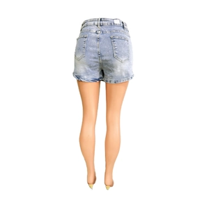 Detail view of light blue washed denim shorts featuring back pockets and rolled hems