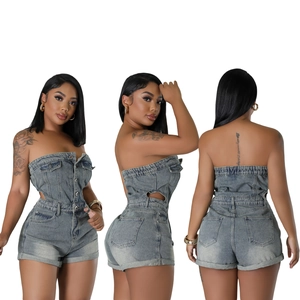 Detail view of strapless denim romper with button closure and side cutout design