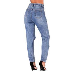 Detail of high waisted slim fit ripped denim jeans with back pocket design and washed finish