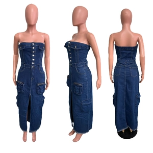 Detail view of denim tube dress with utility pockets, front slit and metal buttons