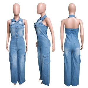 Detail view of light blue denim jumpsuit with halter neck and cargo pockets