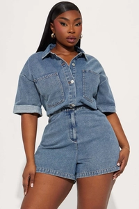 Close-up of women's short sleeve denim jumpsuit with metal buttons and chest pockets