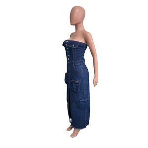 Detailed view of cargo pockets and side slit on the strapless denim maxi dress
