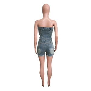 Rear view detail of light blue denim tube romper with waist cut and back pockets