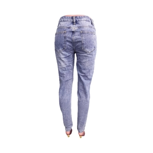 Detail of light blue slim fit denim jeans showing rear pockets and belt loops on back view