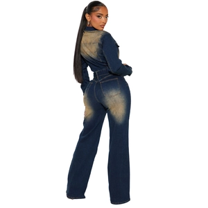 Rear view of slim fit flared denim jumpsuit featuring vintage faded wash and pockets