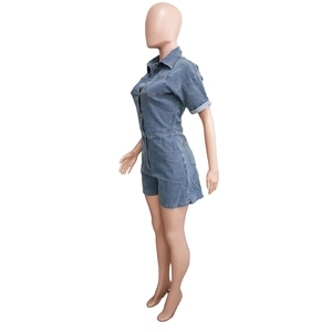 Detail of blue washed denim romper showing side silhouette and contrast stitching lines