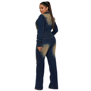 Detail of slim fit denim jumpsuit with vintage acid wash finish and back pocket design