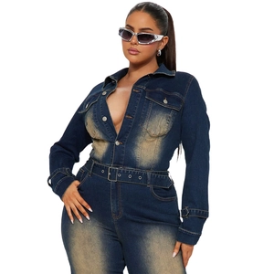 Detailed close-up of dark blue slim fit denim jumpsuit with vintage fading and button front