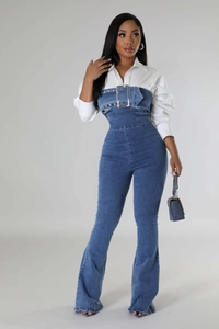 Detail of denim strapless jumpsuit with white shirt, waist belt and metal buckle