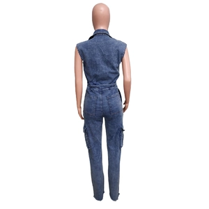 Rear view of a washed blue denim jumpsuit with cargo pockets and elastic waist on a mannequin
