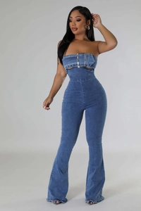 Detail of denim jumpsuit featuring tube top with large metal belt buckle decoration