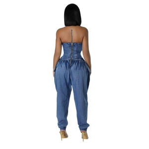 Back view of a blue strapless denim jumpsuit with back zipper and gathered waist