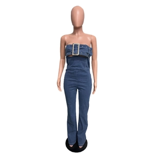 Detail of strapless denim jumpsuit featuring a wide belt with large square metal buckle