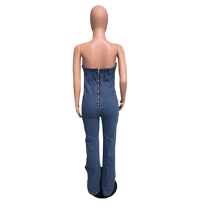 Detailed back view of strapless denim jumpsuit featuring a long metal zipper closure