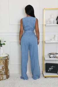 Detail of the back view showing the waist design and wide-leg cut of the denim jumpsuit