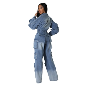 Blue vintage washed denim utility jumpsuit with multi-pocket design and wide-leg fit