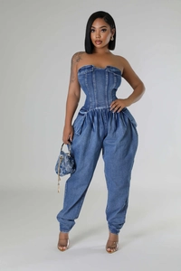Detail of dark blue denim tube top jumpsuit with waist cinching and cargo side pockets